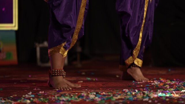 View of two dancers performing Indian classical dance with ankle bells rhythmic movements