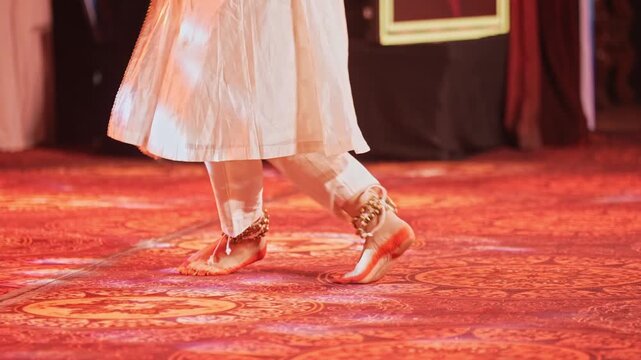 View of a dancer wearing ankle bells performing graceful Indian classical dance movements