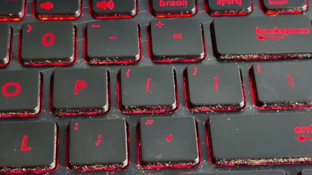 close-up of keyboard typing, finger pressing key, technology concept, glowing red keys, focus detail.
