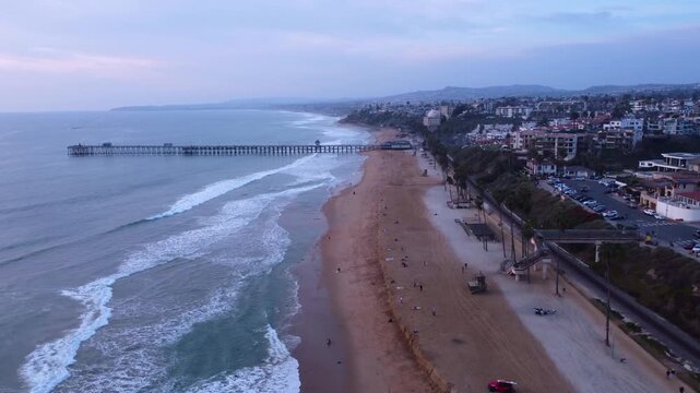 San Clemente, California. View of Long Coastal Pier Overlooking Horizon at Sunset. Looking North to Dana Point, Orange County.