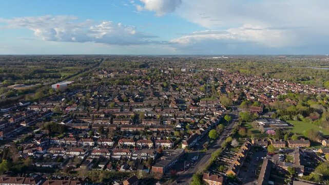 Drone aerial over north Cheshunt establishing view across Turners Hill, Cheshunt Wash and Perrysfield Estate, with the A10 visible on the left under dramatic clouds.