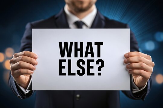 Consultant Holding a Sign Asking the Question 'What Else?'