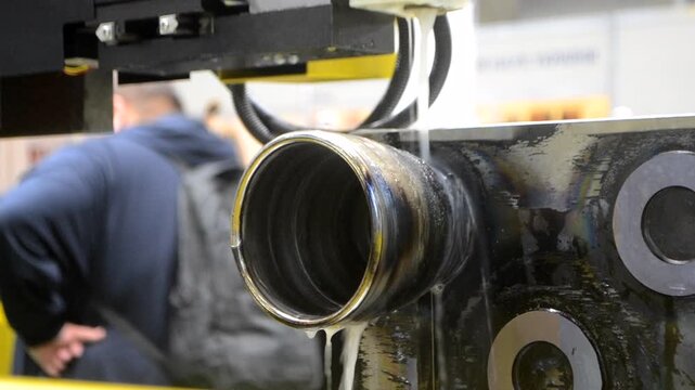 Wire-cut electrical discharge machine. Operation of wire-EDM machine cutting metal parts. Electrical discharge machine EDM cutting metal workpiece. Cutting process by wire cut machine. Metalworking