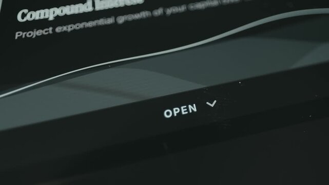 Finger taps the Open button to access information about Compound Interest