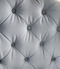Naklejka premium Light Blue Tufted Fabric Upholstery Texture with Buttons, Fabric textile material details