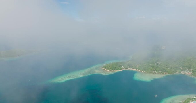 Misty and Foggy aerial view of Islands and blue sea in Romblon, Philippines.