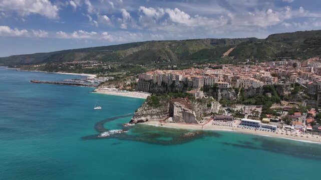 Drone flyby of Tropea coastline and town from left to right, Calabria, Italy