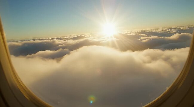 Golden sunrise view from airplane window, majestic clouds at high altitude, aerial perspective of sun flare over fluffy white cloudscape