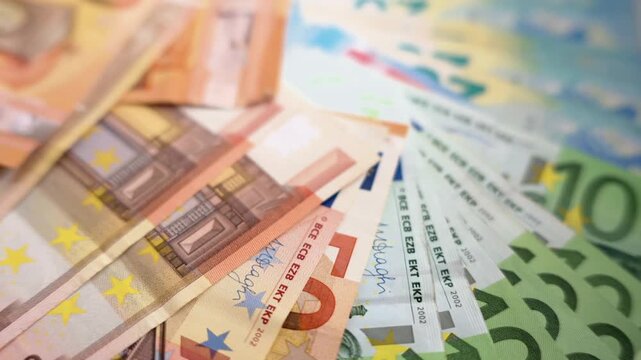 European currency notes lying on flat surface showing fifty and hundred euro cash denominations clip.
