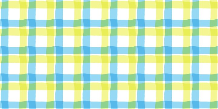Yellow and blue plaid pattern background. Fresh checkered gingham texture for summer textile, wallpaper, or wrapping paper.