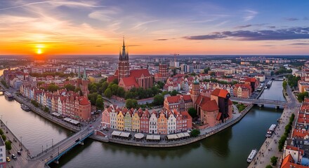 Fototapeta premium Panoramic cityscape at sunset buildings river and dramatic sky view