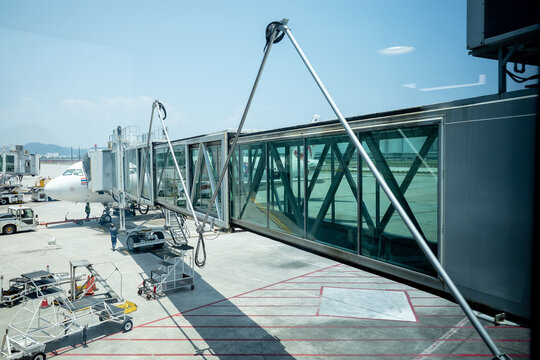 Penang Malaysia- March 23 2026 : External view of a airport skybridge extended to an aircraft waiting to board passengers at Penang International Airport, Penang.