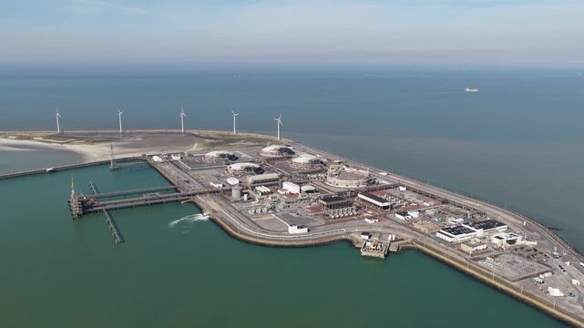 Aerial view of lng terminal and wind turbines at dunkirk port