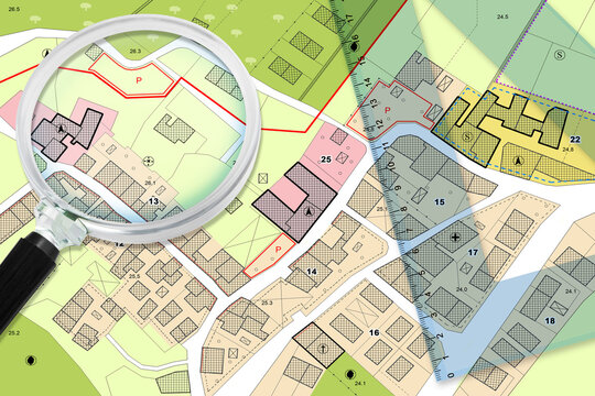 Plastic set square and magnifying glass over an imaginary General Urban Plan - 3D render concept image with copy space - note: the map is totally invented and does not represent any real place