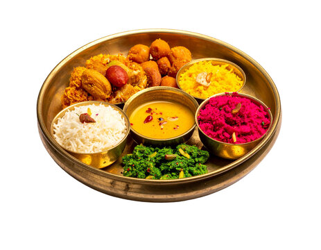 Chhath puja prasad thali with colorful offerings and sweets arranged on a traditional brass plate