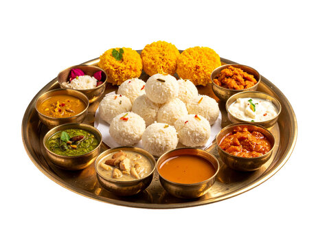 Chhath puja prasad thali with dim sweets and spiced curries on brass plate