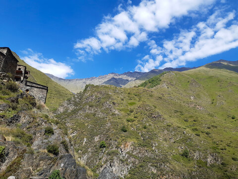 Scenic view of Mutso fortress and lush green mountains in Khevsureti, Georgia