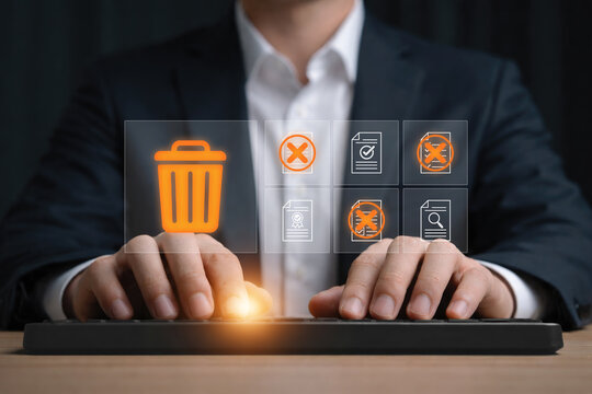 Data management concept with hand deleting digital files and documents showing data cleanup, file removal, privacy protection, information management and secure document disposal business technology.