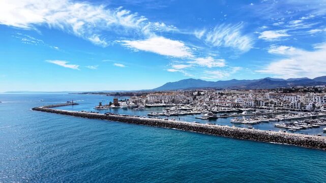 Puerto Ban&uacute;s marina video, aerial drone view of harbor, beach and coastline in Marbella, Spain