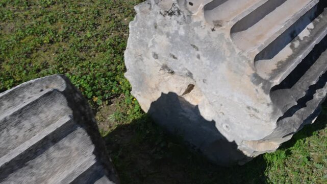 Walking past ancient fallen fluted columns at Letoon ruins in Turkey