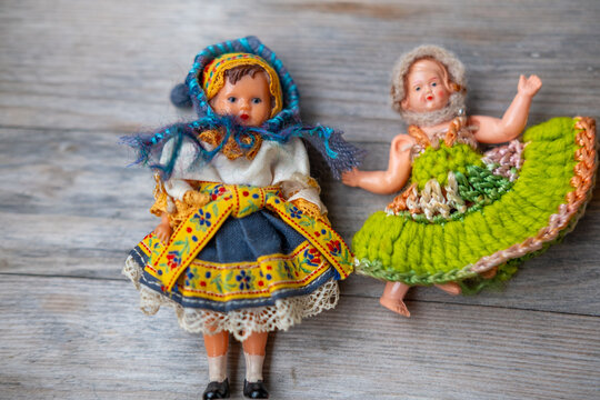 Vintage plastic doll, dress, retro toy, folk craft aesthetic, nostalgic childhood still life memories, celluloid doll face evoking nostalgia, antique collectible representing history and craftsmanship