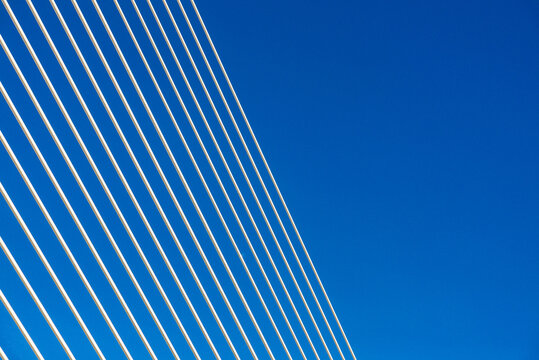 Diagonal bridge cables against blue sky in Valencia