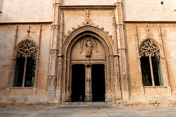 Fototapeta premium Llotja de Palma Gothic entrance with angel relief and tracery