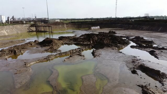 Industrial Wastewater Pond with Contaminated Water and Dry Land