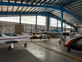 Multiple Light Aircraft Inside Hangar © Azam Askarian