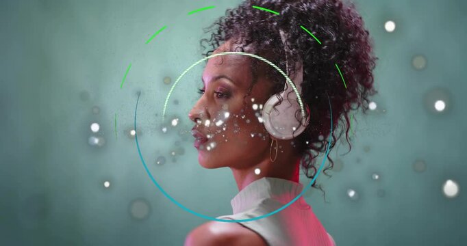 Turning model in ribbed top, white headphones adjusting cups in studio as ring appearing for demo