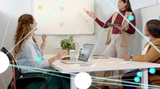 Left member gesturing, presenter pointing and placing notes, network overlay showing business plan