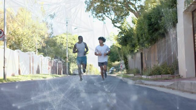 Two male runners starting run toward camera on quiet road, training with overlay across lower frame