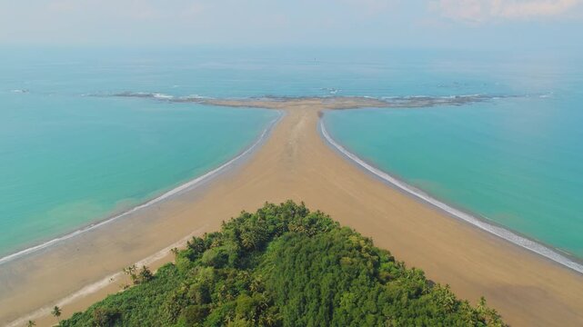 Aerial view of Whale Tail rock and sand formation in Marino Ballena Costa Rica
