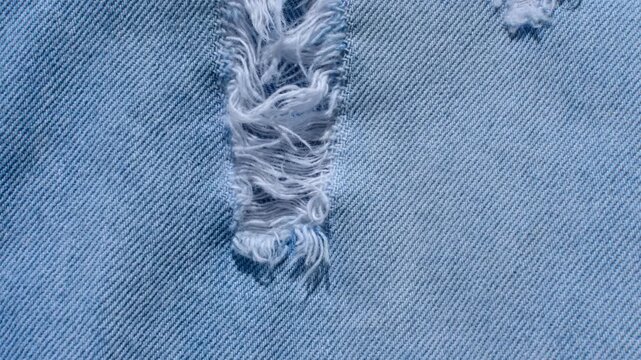 Detailed denim close-up, revealing the indigo blue texture and stitching, perfect for fashion and design projects.
