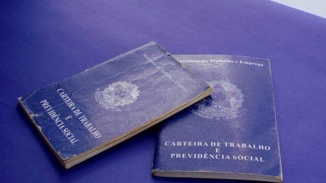 Brazilian work permit on blue surface: professional emblem in stark contrast with the blue background, representing the journey and value of work in Brazil.