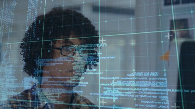 Developer scanning code on monitor, reading code overlay and typing while debugging, smiling