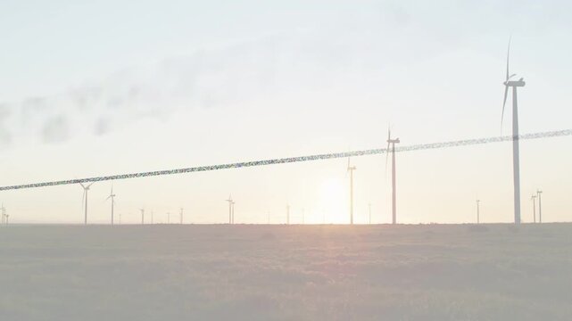 Wind farm turbines spinning at horizon as breeze pushing plume and sun moving, generating power