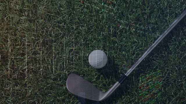 On playback start golf ball and club head showing HUD overlays, showing swing metrics on turf
