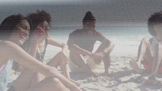 Left woman leaning in, causing group laughing on sandy beach, scanline flickering for lifestyle