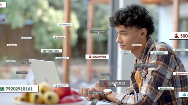 Man using laptop at table touching keyboard message labels appearing peaking fading for remote work