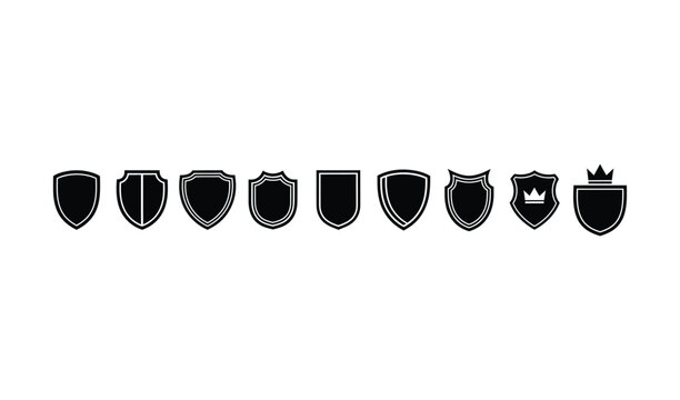 Collection of various black shield icons with different shapes and crown designs on isolated for security and protection concepts