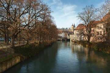 Obraz premium Scenic view of the Neckar canal and historic old town with church spires in Esslingen
