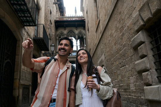 Tourists exploring historic barri gotic street in barcelona