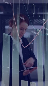Vertical video: Tapping woman after overlay update, checking tablet for stocks in office in blazer