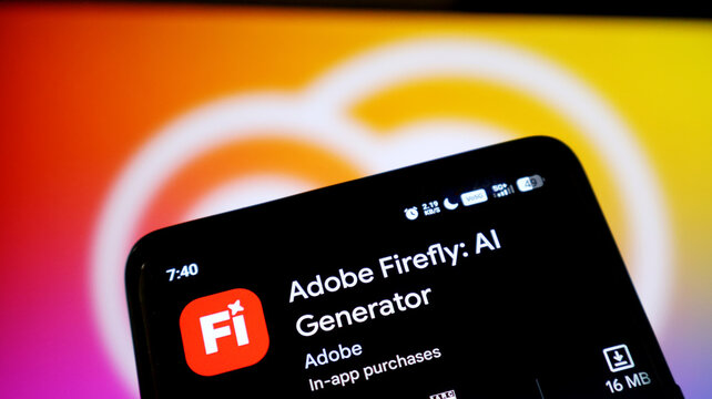 Closeup of a smartphone screen displaying the adobe firefly ai generator app page