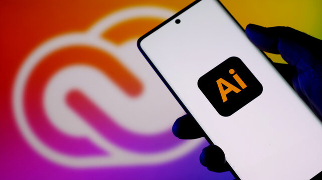 Adobe illustrator logo on a smartphone screen with adobe creative cloud background