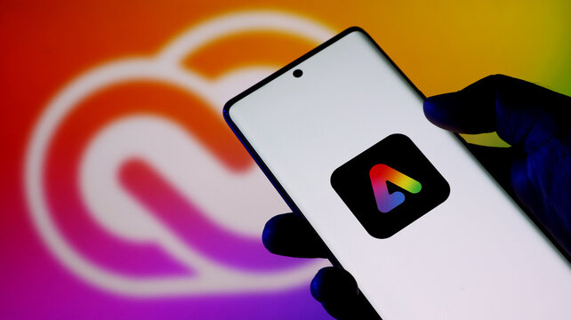 Closeup of a smartphone displaying the adobe creative cloud app icon