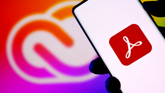 Adobe acrobat logo displayed on a smartphone screen with adobe creative cloud background