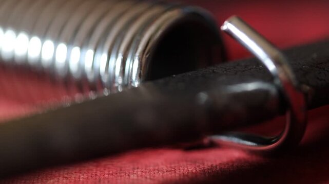 A close-up shot of a knife resting on a red cloth, perfect for use in crime scene or mystery novel illustrations