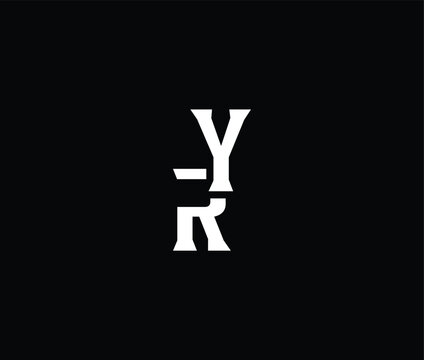 Closeup of large white block letters YR on dark background selectively focusing on the letters RY